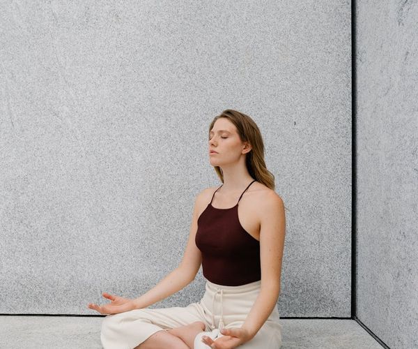 A serene person meditating, representing mental clarity and peace.